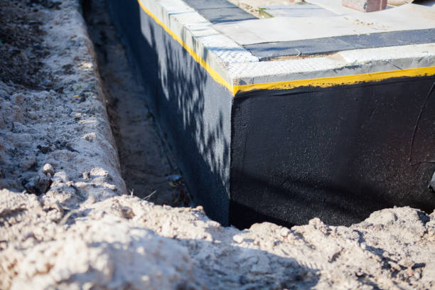 Professional Exterior Waterproofing technician working in Midland, IN